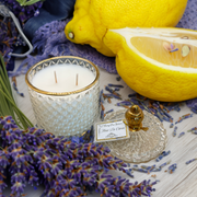 Fleur de Citron scented candle in clear glass jar with gold label
