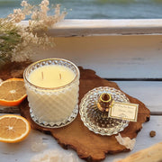 Marine Mist scented candle in clear glass jar with gold label
