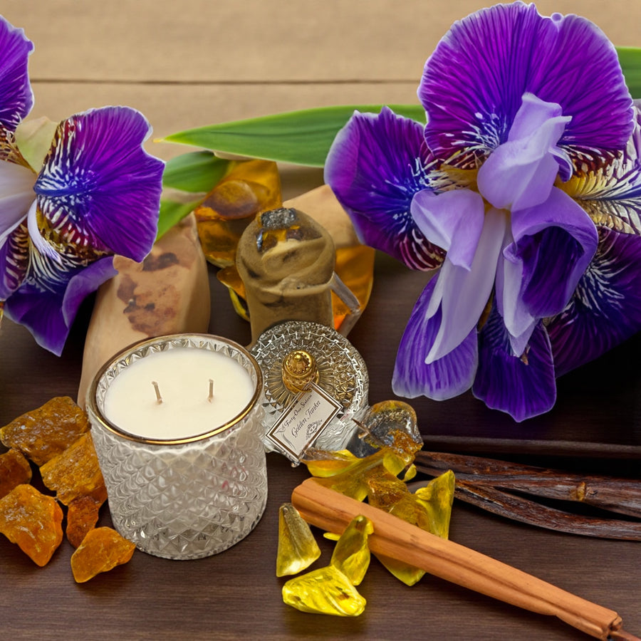 Golden Tonka scented candle in clear glass jar with gold label
